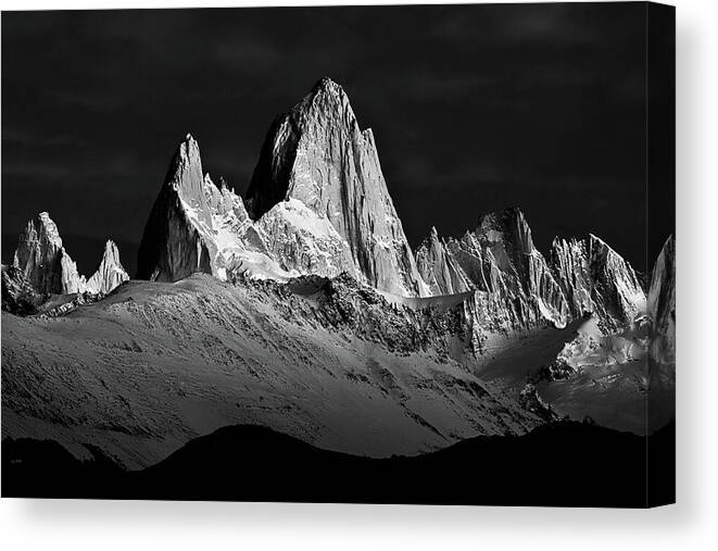 a black and white photo of a mountain range