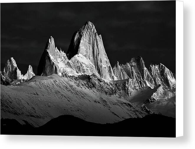 a black and white photo of a mountain range