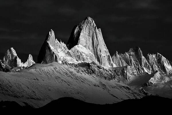 a black and white photo of a mountain range